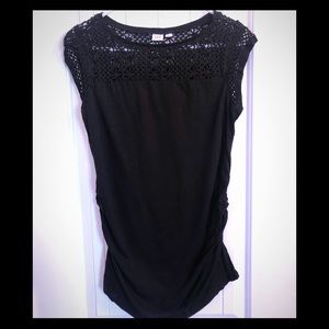 Black fitted maternity top with crocheted detail